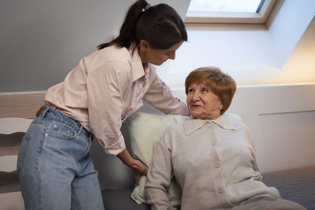 female nurse taking care elderly person